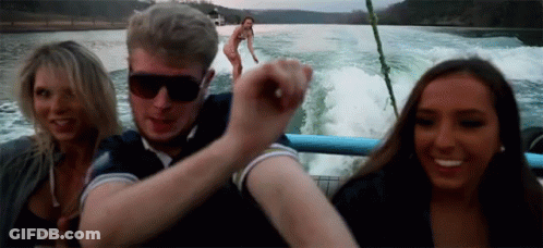 Man, Two Women On Boat, Background Woman GIF