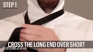 Man Tying Tie Long End Over Short End GIF