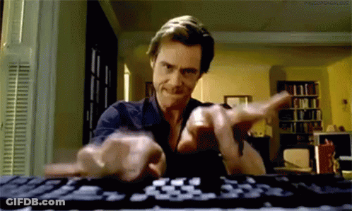 Man Typing On Computer Keyboard In Living Room GIF