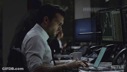 Man Typing On Laptop With Netflix Logo GIF