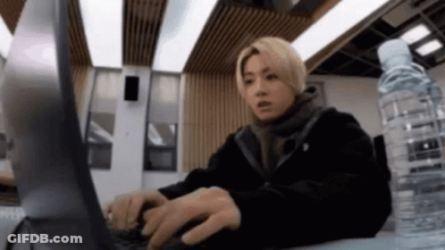 Man Typing On Laptop With Water GIF