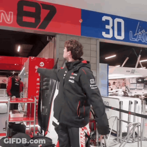 Man Under Sign Saying 30 GIF