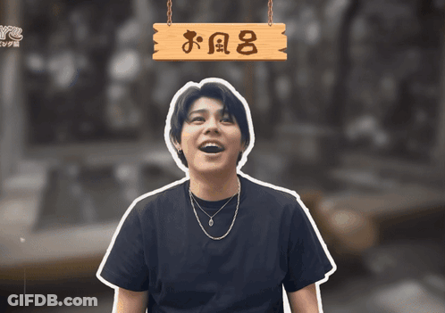 Man Under Sign Saying お風呂 GIF