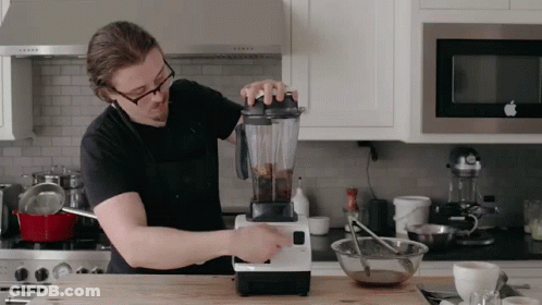 Man Using Blender In Kitchen GIF