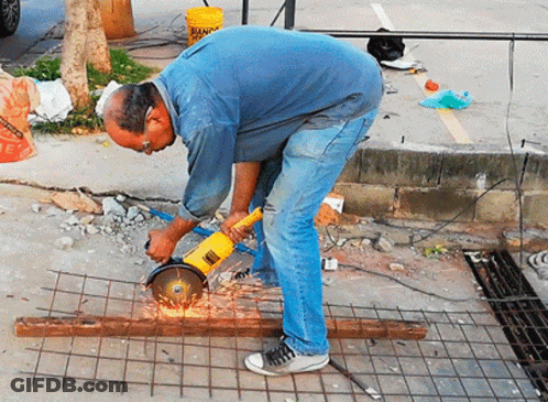 Man Using Grinder To Cut Metal GIF