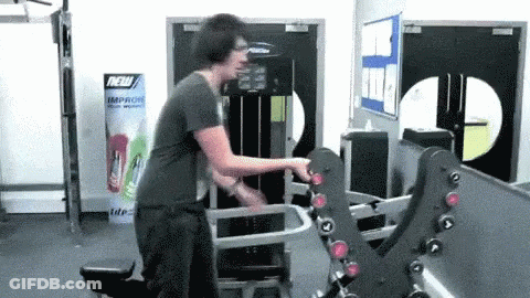 Man Using Gym Machine By Sign Saying New Improve Your Work GIF