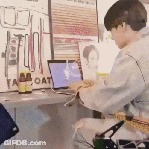 Man Using Laptop And Guitar At Desk GIF