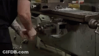 Man Using Machine To Cut Metal In Factory GIF