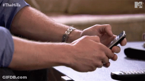 Man Using Smartphone With Hills Text GIF