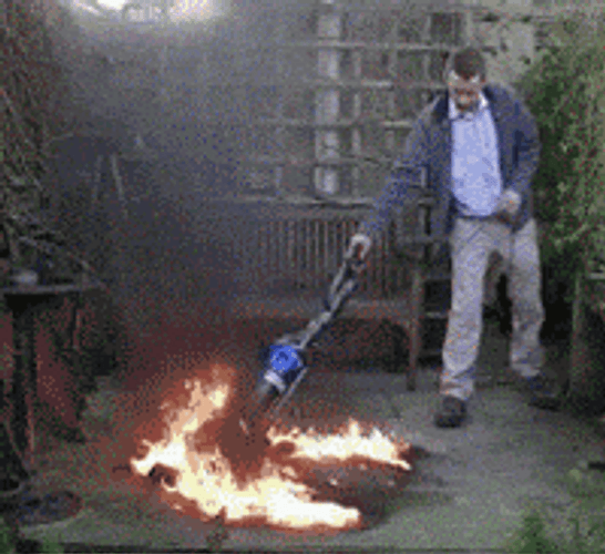 Man Vacuumed A Small Fire Tornado GIF