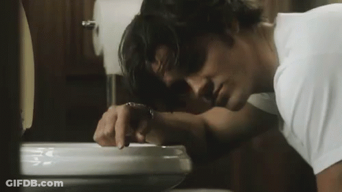 Man Vomiting Into Toilet Bowl GIF