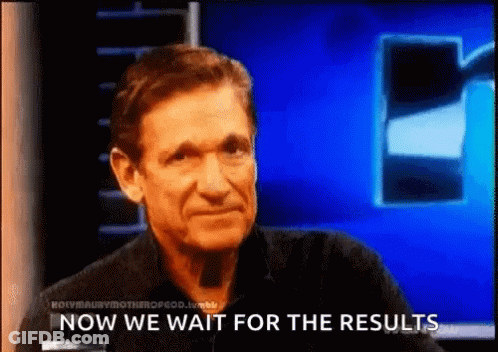 Man Waiting For Results In Front Of Blue Screen GIF