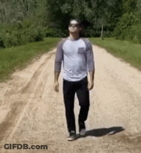 Man Walking Dirt Road With Sunglasses GIF