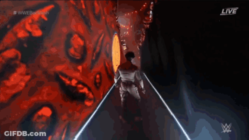 Man Walking Down Hallway With WWE Logo GIF