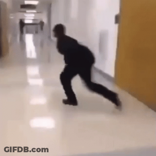 Man Walking Down Hospital Hallway GIF