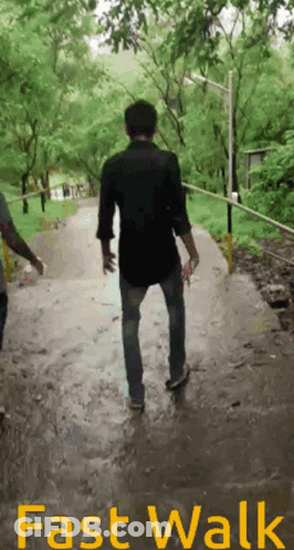 Man Walking Down Path Fast Walk GIF