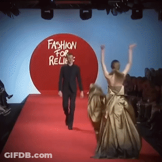 Man Walking Down Red Carpet In Front Of Fashion For Relies Sign GIF