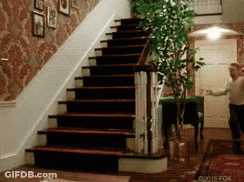 Man Walking Down Stairs In Home GIF