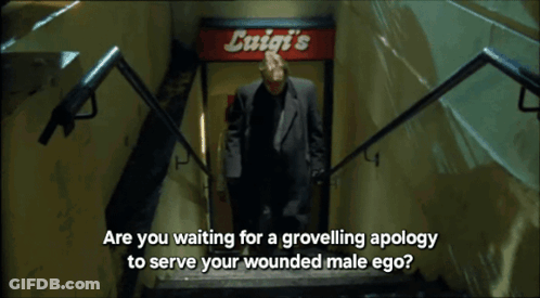 Man Walking Down Stairs With Exit Sign GIF