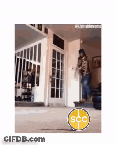 Man Walking Down Stairs With SCC Logo In Living Room GIF