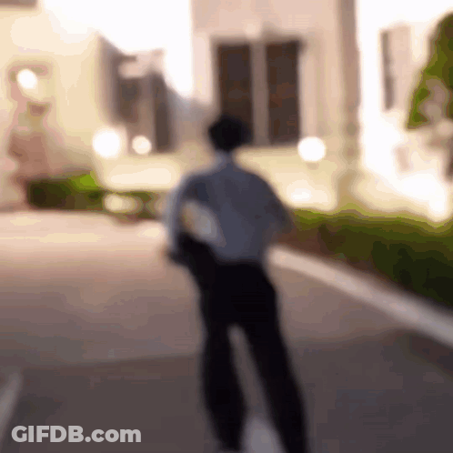 Man Walking Down Street GIF