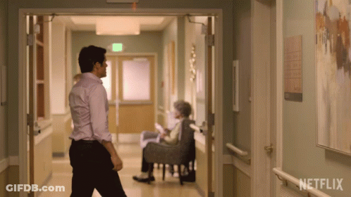 Man Walking Hospital Hallway Netflix Sign GIF