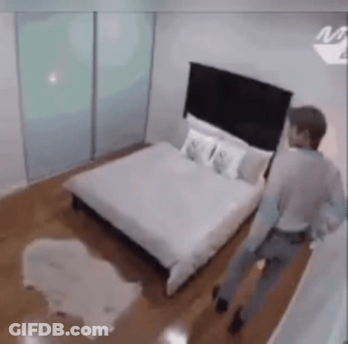Man Walking In Bedroom GIF