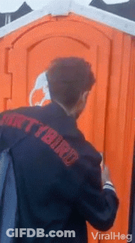 Man Walking In Front Of Blue Pixi Toilets GIF