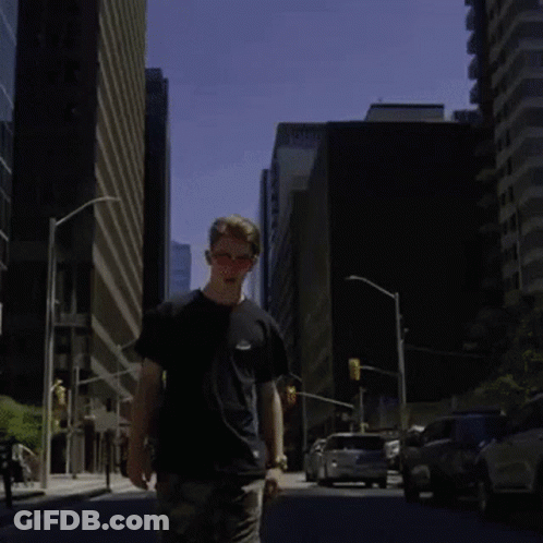 Man Walking In Front Of Matches Wall GIF