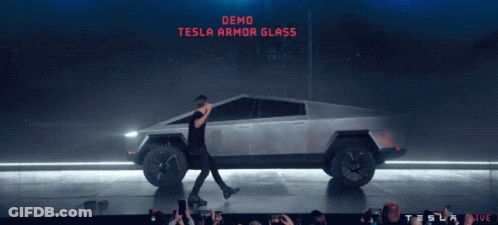 Man Walking In Front Of Tesla Car Saying Demo Tesla Armor Glass GIF