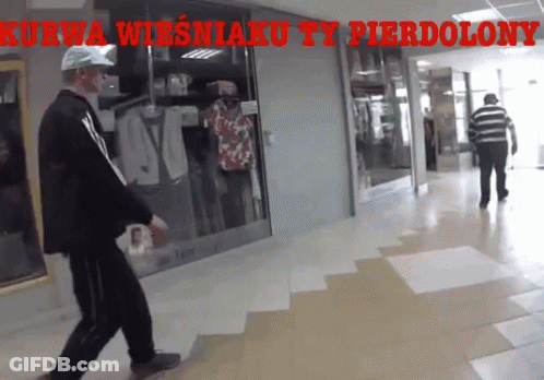 Man Walking In Hallway With Kurwa Wiesniaku Ty Pierdolony GIF