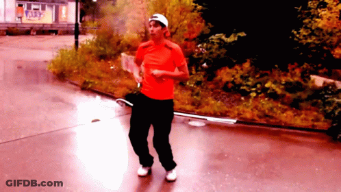 Man Walking In Red Shirt And Black Pants GIF
