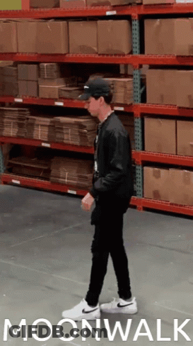 Man Walking In Warehouse Moonwalk GIF
