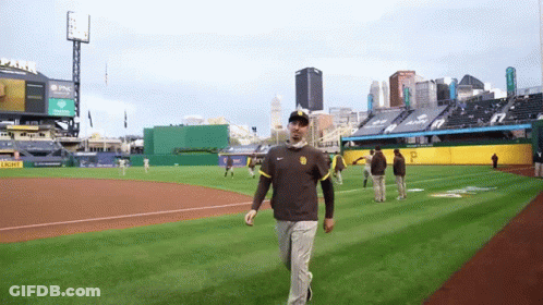 Man Walking On Baseball Field With Light Sign GIF