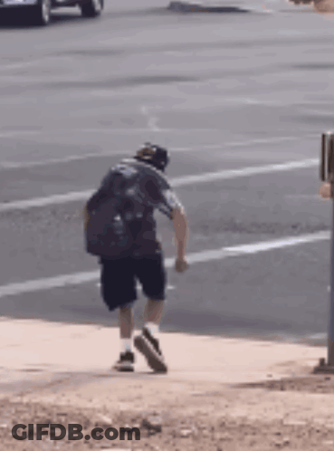Man Walking On Sidewalk GIF