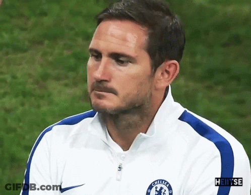 Man Walking On Soccer Field In Front Of Heineken And Nissan Sign GIF