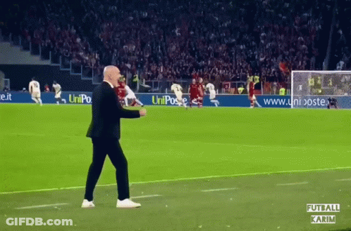 Man Walking On Soccer Field With Uniposte Ad GIF
