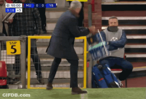 Man Walking On Soccer Field With Water Bottle GIF