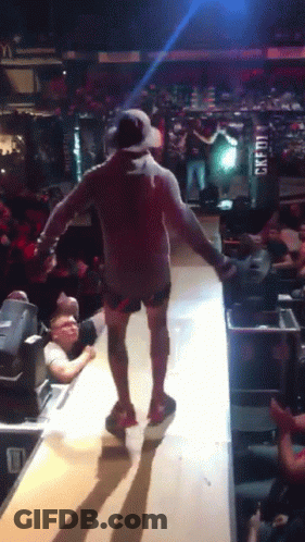 Man Walking On Stage With Credit Sign GIF