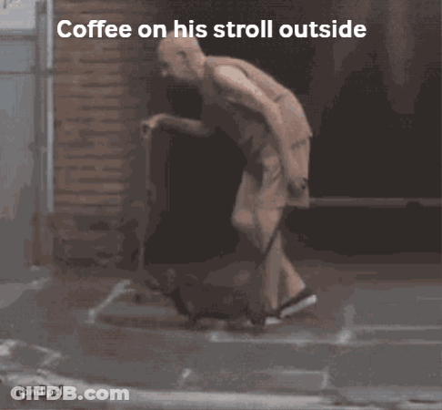 Man Walking Outside With Coffee GIF