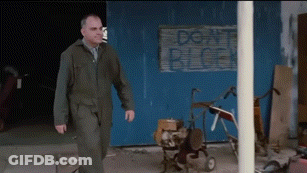 Man Walking Past Don't Block Sign GIF