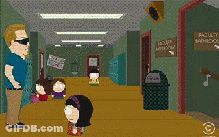 Man Walking Past Faculty Bathroom Sign GIF
