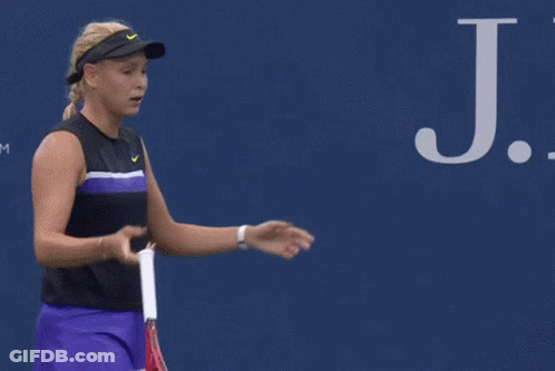Man Walking Past Ford Ad On Tennis Court GIF