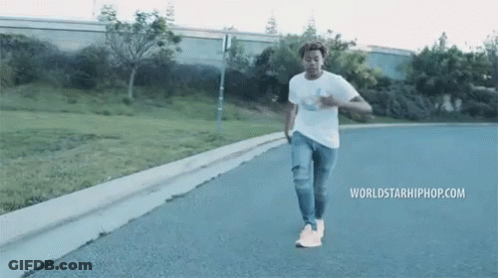 Man Walking Street With Worldstarhiphop.com GIF