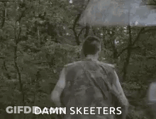 Man Walking Through Forest With Umbrella Saying Damn Skeeeters GIF
