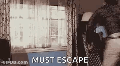 Man Walking Through Living Room Saying Must Escape GIF