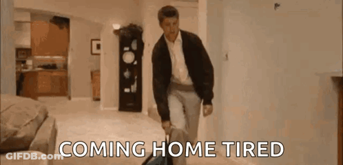 Man Walking Through Living Room With Suitcase Coming Home Tired GIF