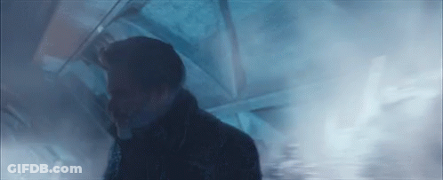 Man Walking Through Smoke-Filled Room GIF