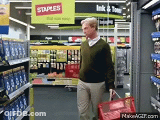 Man Walking Through Staples Store With Red Basket GIF