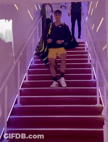 Man Walking Up Stairs With Nike Bag GIF